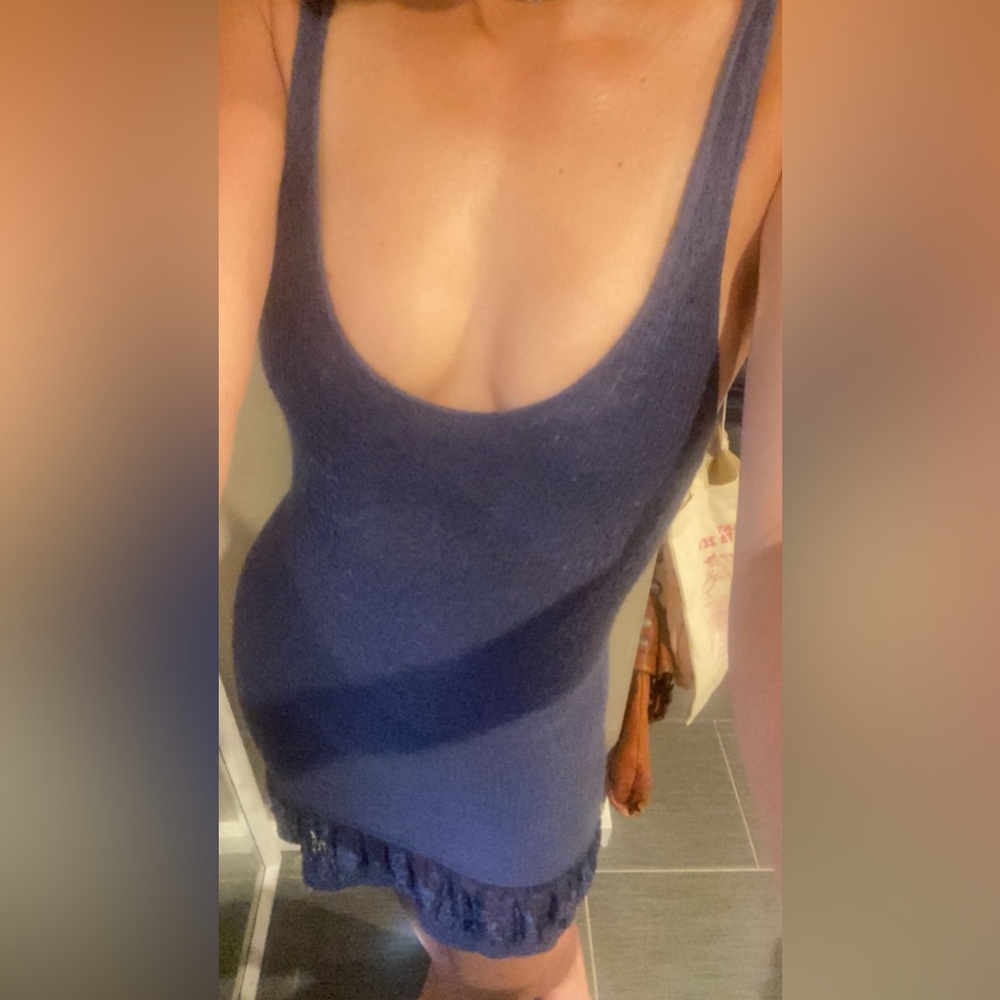 Blue mini tight dress with ruffles on the bottom. Very flattering and pretty